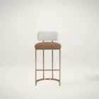 A modern Larissa Stool featuring a warm caramel leather seat, curved white boucle backrest, and slim brushed brass metal frame.