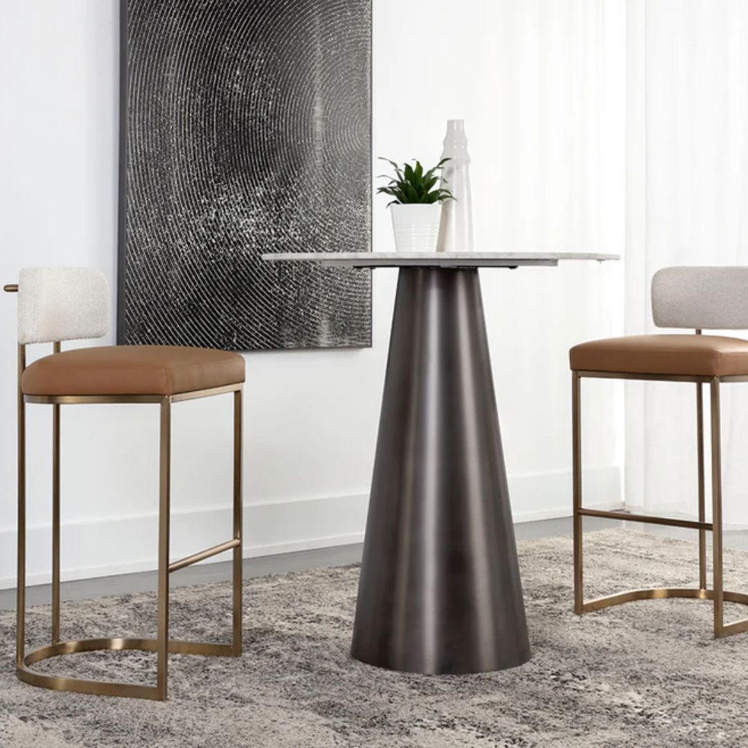 A modern Larissa Stool featuring a warm caramel leather seat, curved white boucle backrest, and slim brushed brass metal frame.