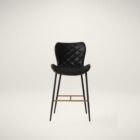 Diamond-stitched black leather seat upholstery, with quilted seat and brass footrest.