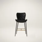 Diamond-stitched black leather seat upholstery, with quilted seat and brass footrest.
