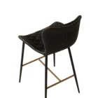 Diamond-stitched black leather seat upholstery, with quilted seat and brass footrest.