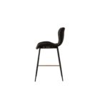 Diamond-stitched black leather seat upholstery, with quilted seat and brass footrest.