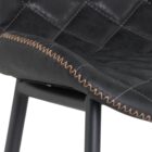 Diamond-stitched black leather seat upholstery, with quilted seat and brass footrest.