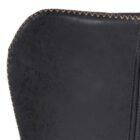 Diamond-stitched black leather seat upholstery, with quilted seat and brass footrest.