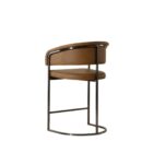 Modern counter stool featuring a curved saddle leather backrest, cushioned seat, and sleek black metal frame with an arched footrest.