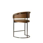 Modern counter stool featuring a curved saddle leather backrest, cushioned seat, and sleek black metal frame with an arched footrest.
