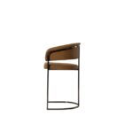 Modern counter stool featuring a curved saddle leather backrest, cushioned seat, and sleek black metal frame with an arched footrest.