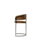 Modern counter stool featuring a curved saddle leather backrest, cushioned seat, and sleek black metal frame with an arched footrest.