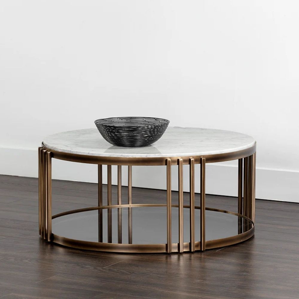 Round marble coffee table with a white stone top, antique brass metal frame, and a smoked glass lower shelf.