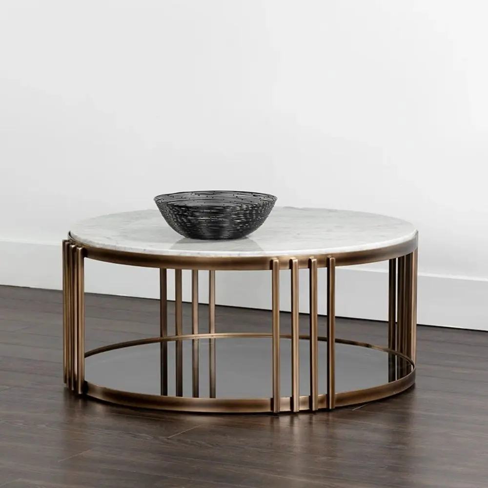 Round marble coffee table with a white stone top, antique brass metal frame, and a smoked glass lower shelf.