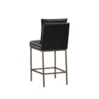 Paige Counter Stool featuring a black faux leather upholstered seat and loose-style back cushion, set on a brushed metal frame with footrest