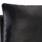 Paige Counter Stool featuring a black faux leather upholstered seat and loose-style back cushion, set on a brushed metal frame with footrest