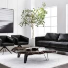 Live-edge sculptural coffee table crafted from dark natural teak wood with organic curves and black angular legs.