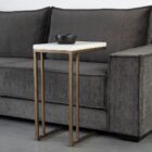 Modern white C-shaped end table with a thin metal base in a bronze finish and a sleek white top.