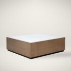 Square coffee table with a white top, warm brass-toned sides, and a low black plinth base.