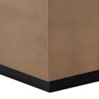 Square coffee table with a white top, warm brass-toned sides, and a low black plinth base.