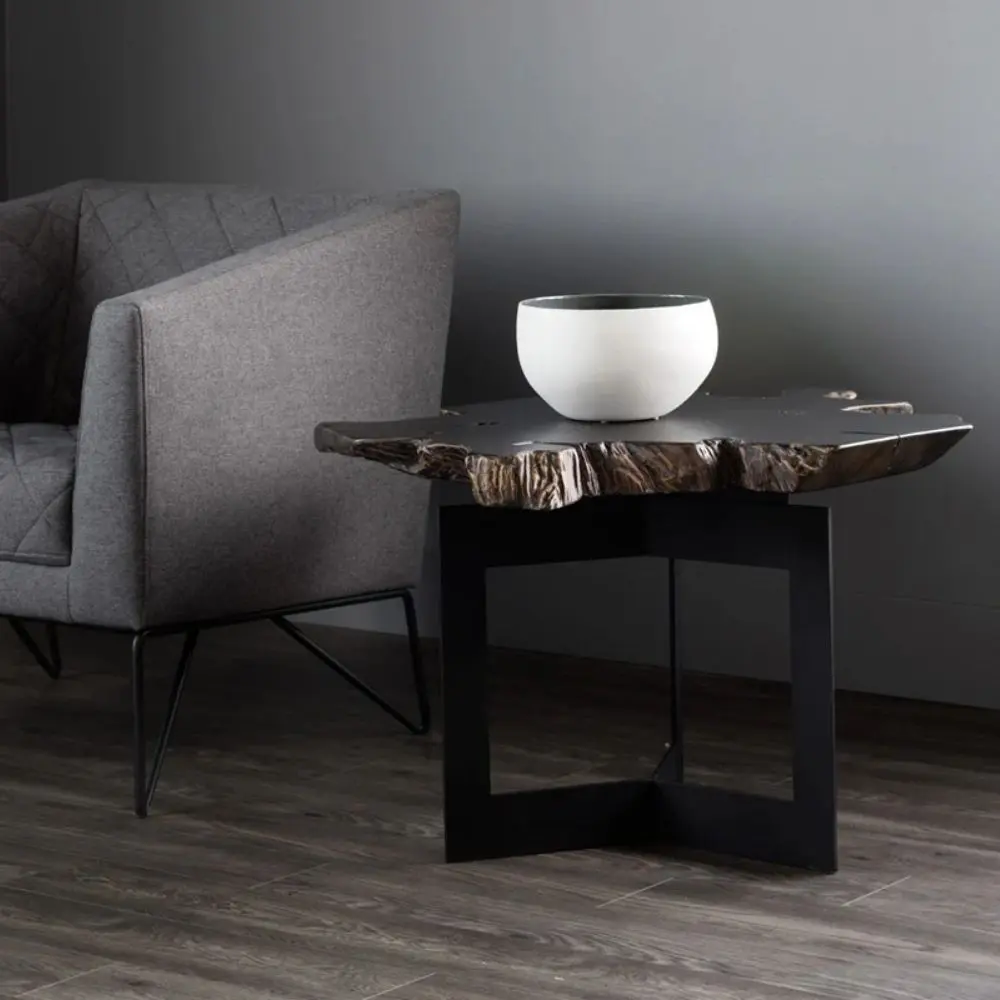 Rustic modern side table featuring a natural-edge solid wood slab top and intersecting matte black metal base.