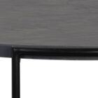 Round black coffee table with slim metal frame, lower glass shelf, and gold-dipped leg tips.