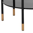 Round modern end table with black textured top, slim black legs, lower shelf, and brass-capped feet.