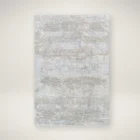 Brunswick Machine Woven Rug in soft greys, creams, and beige tones with a distressed abstract pattern.
