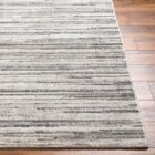 Close-up of Hollister Handmade Rug showing textured linear pattern in neutral tones.