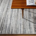Close-up of Hollister Handmade Rug showing textured linear pattern in neutral tones.