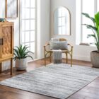 Close-up of Hollister Handmade Rug showing textured linear pattern in neutral tones.