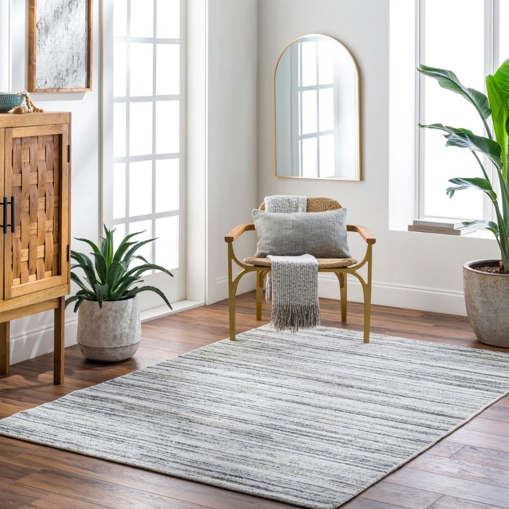 Close-up of Hollister Handmade Rug showing textured linear pattern in neutral tones.
