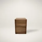 Walnut filing and storage cabinet with three soft-close drawers in a minimalist, modern silhouette