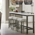 Contemporary console table with white top, gunmetal frame, and three matching upholstered stools.