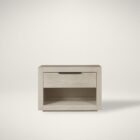 A modern Huston Nightstand featuring a sleek open-frame design with a single drawer and lower shelf in a light wood finish, styled beside a contemporary bed.