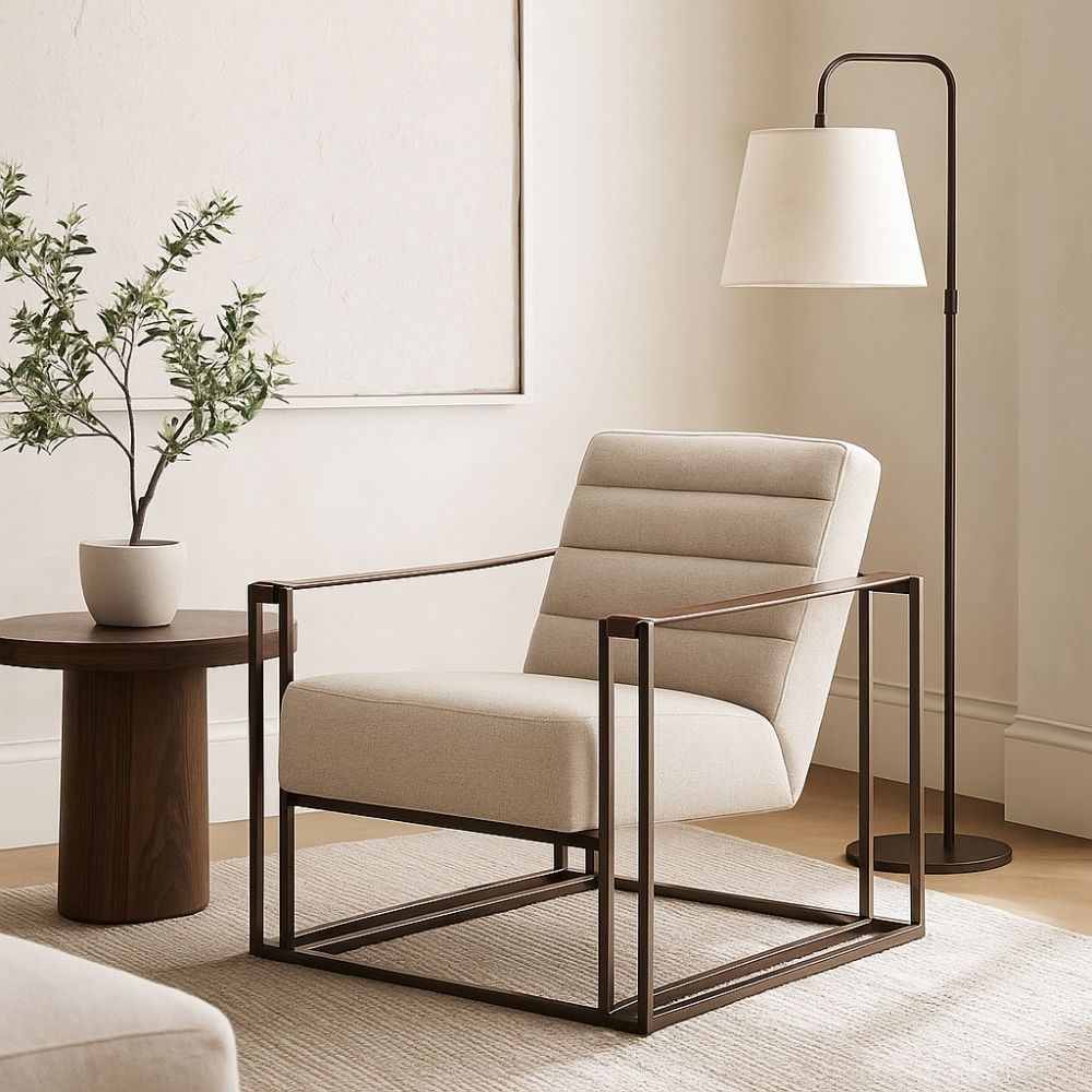 Modern accent chair with beige channeled upholstery, open iron frame, and wooden arm inlays