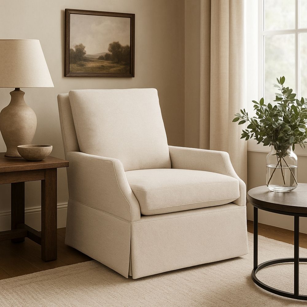 Traditional beige upholstered armchair with tailored skirt, tight back, and plush seat cushion.