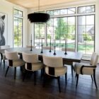 Loleta Side Chair with cream seat upholstery, channeled backrest, and tapered dark wood legs.