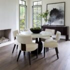 Loleta Side Chair with cream seat upholstery, channeled backrest, and tapered dark wood legs.