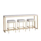 Elegant console table with a white top and brushed gold frame, paired with three coordinating upholstered stools.