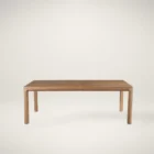 A minimalist rectangular wood dining table with soft-rounded edges and natural grain finish, shown in a studio-style background.