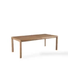 A minimalist rectangular wood dining table with soft-rounded edges and natural grain finish, shown in a studio-style background.