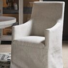 Manning Slipcover Chair featuring a structured silhouette in creamy textured fabric with a tailored slipcover and classic armrests.