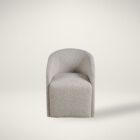 Marlow Dining Chair in soft grey fabric with modern curved silhouette.