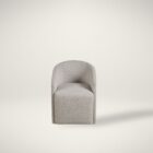 Marlow Dining Chair in soft grey fabric with modern curved silhouette.