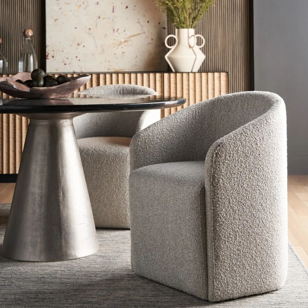 Marlow Dining Chair in soft grey fabric with modern curved silhouette.
