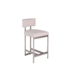 A modern counter stool featuring a soft upholstered back and seat in a neutral woven fabric, supported by a sleek polished metal frame with a footrest.
