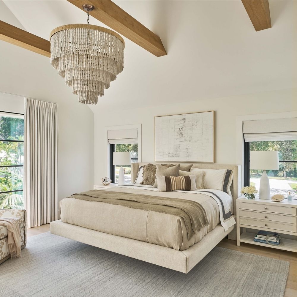 Sainte-Anne Upholstered Bed in a soft neutral fabric with modern wingback headboard and floating platform design.