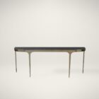 Modern console table with a sleek black stone top and elegant, tapered brass legs that curve into a rounded-edge profile.