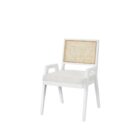 Sonora Arm Chair featuring a white wood frame, woven rattan backrest, and soft upholstered seat in neutral fabric.