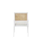 Sonora Arm Chair featuring a white wood frame, woven rattan backrest, and soft upholstered seat in neutral fabric.