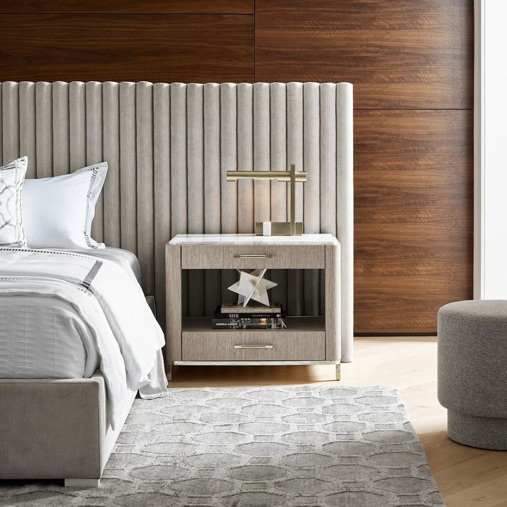 The Soren Bedside Table with marble top and wood body featuring two drawers and open shelf.