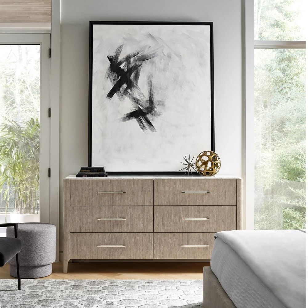 Soren Dresser featuring six drawers, marble top, and metal handles.