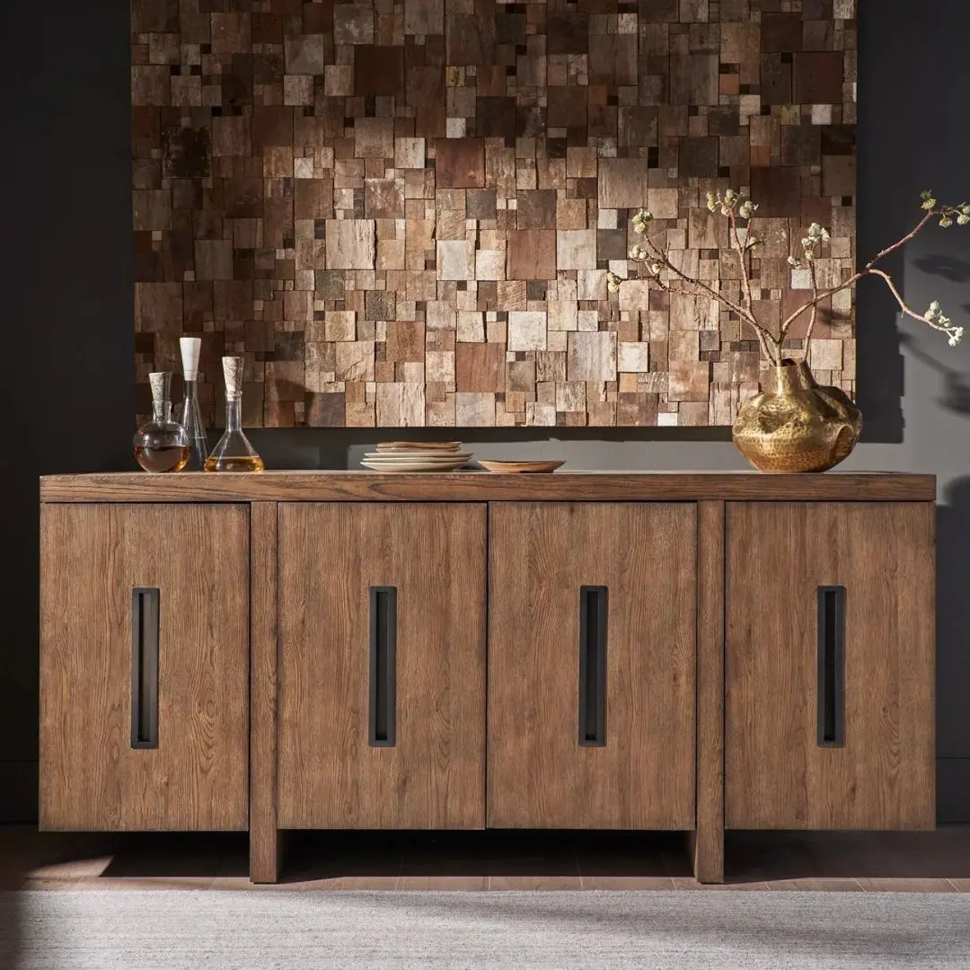 A modern wooden credenza with a warm walnut finish and four cabinet doors, each featuring a vertical rectangular glass inset for subtle transparency.